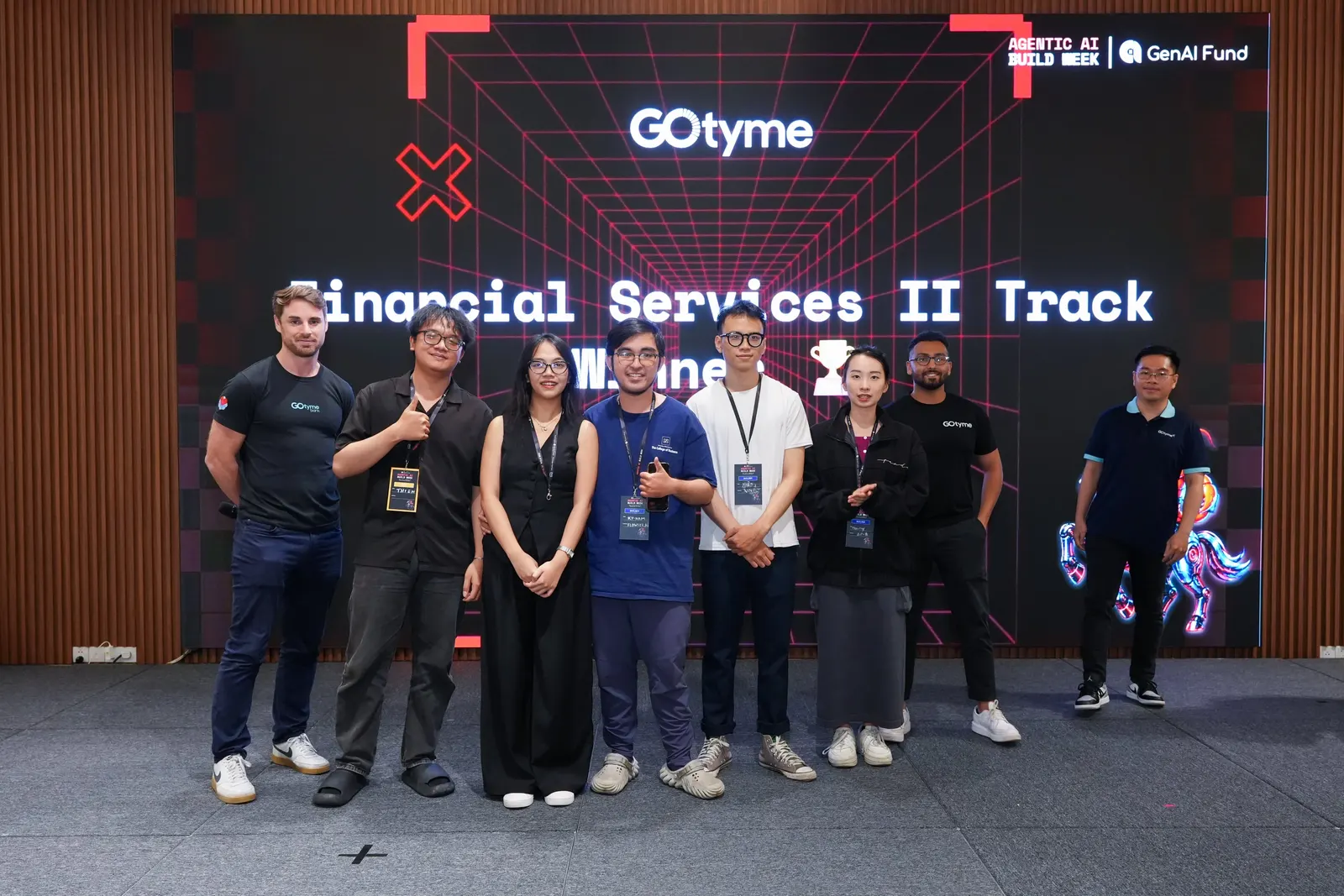 Thao with her team on stage after taking 2nd place at Agentic AI Build Week 2026