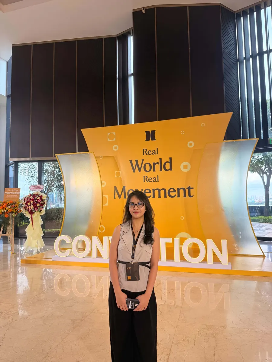 Thao standing in front of the CONVICTION 2026 stage sign
